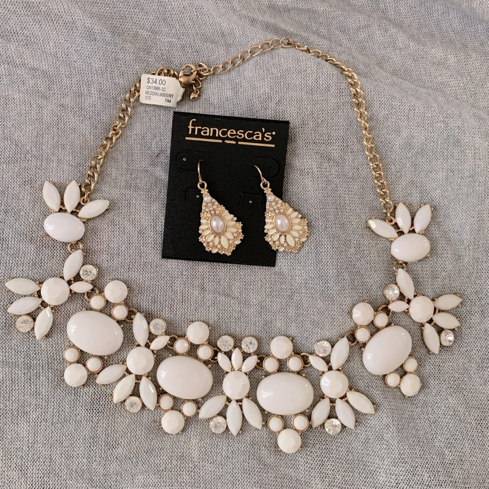 Gold and white costume jewelry. Necklace and matching earrings.